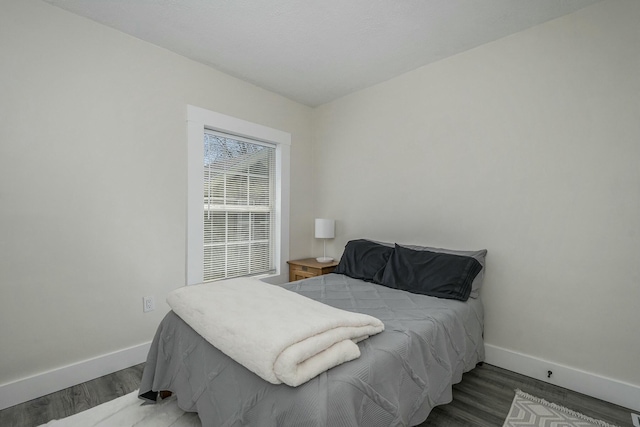 1146 Hall St SE, Grand Rapids, MI 49507 - bedroom with baseboards and wood finished floors