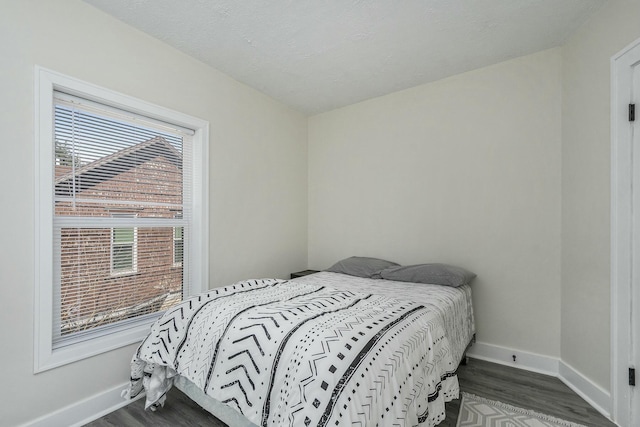 1146 Hall St SE, Grand Rapids, MI 49507 - bedroom with baseboards and wood finished floors