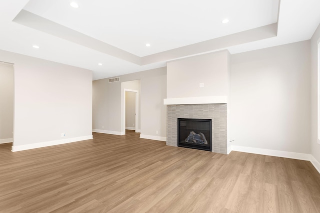 unfurnished living room with recessed lighting, light wood finished floors, and visible vents