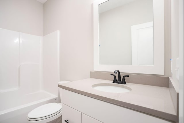 full bathroom with vanity, bathtub / shower combination, and toilet
