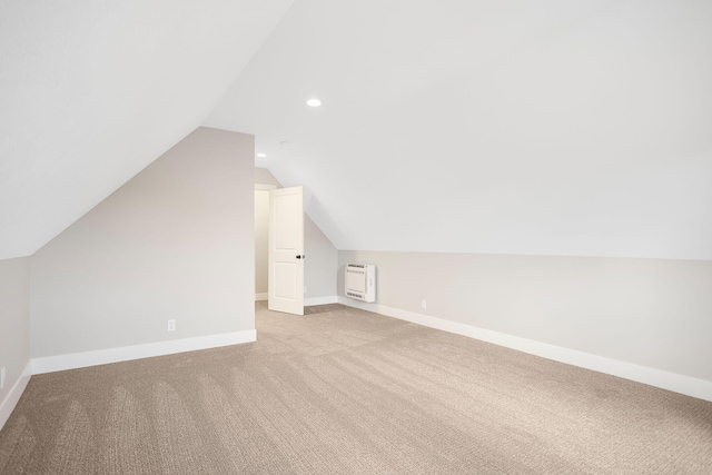 bonus room with recessed lighting, baseboards, vaulted ceiling, and light carpet