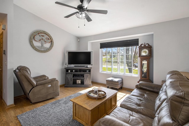 1077 Sun Valley Ln, Allegan, MI 49010 - living room with light wood-style floors, baseboards, ceiling fan, and lofted ceiling