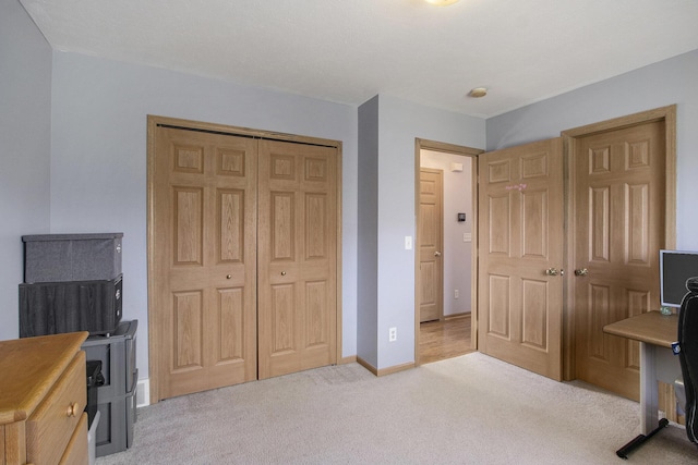 1077 Sun Valley Ln, Allegan, MI 49010 - carpeted bedroom featuring baseboards and a closet