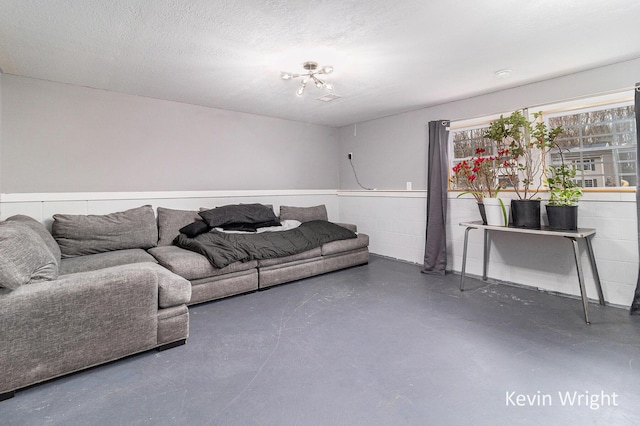 living area featuring finished concrete floors