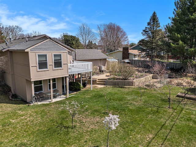 17653 Hiawatha Dr, Spring Lake, MI 49456 - rear view of house with a patio, roof with shingles, and a deck