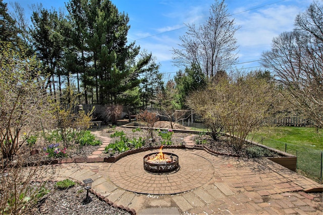 17653 Hiawatha Dr, Spring Lake, MI 49456 - view of patio featuring an outdoor fire pit