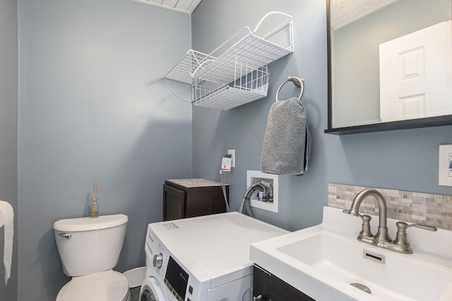 17653 Hiawatha Dr, Spring Lake, MI 49456 - half bath with tasteful backsplash, washer / dryer, toilet, and vanity
