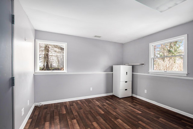 17653 Hiawatha Dr, Spring Lake, MI 49456 - unfurnished room featuring dark wood-style flooring and baseboards