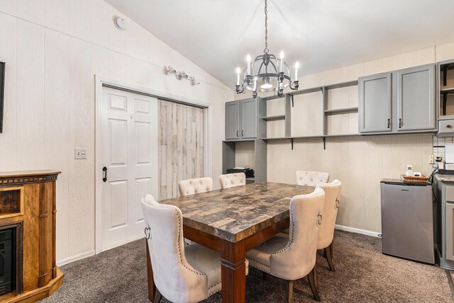 17653 Hiawatha Dr, Spring Lake, MI 49456 - dining space with a chandelier, dark colored carpet, and lofted ceiling