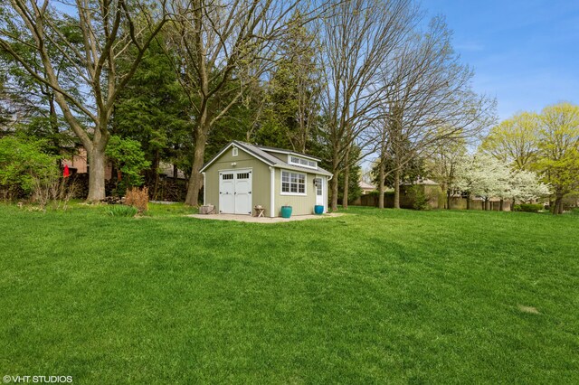 2235 Winters Way, Saint Joseph, MI 49085 - view of yard with a detached garage, fence, and an outdoor structure