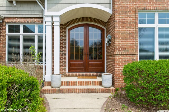 2235 Winters Way, Saint Joseph, MI 49085 - view of exterior entry with brick siding and french doors