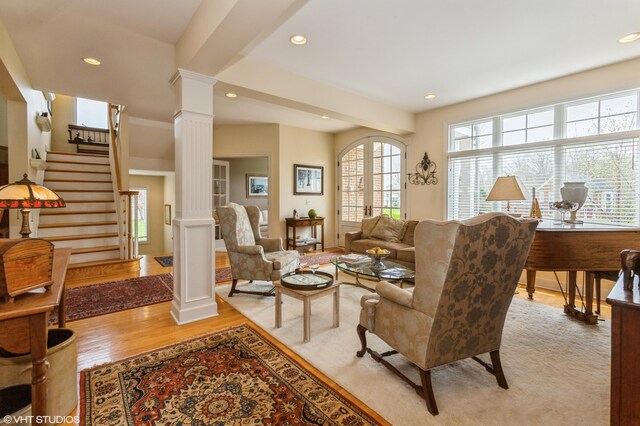 2235 Winters Way, Saint Joseph, MI 49085 - living room featuring ornate columns, recessed lighting, stairway, and light wood-type flooring