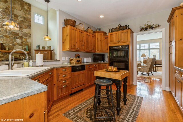 2235 Winters Way, Saint Joseph, MI 49085 - kitchen with a sink, plenty of natural light, dobule oven black, and light wood-type flooring
