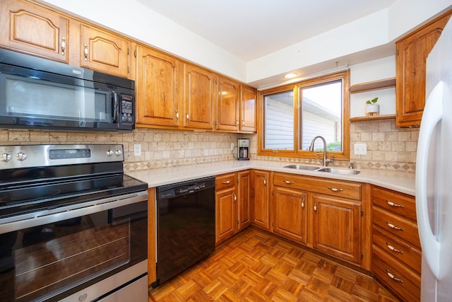 3108 N Rivers Edge Dr, Wayne, MI 48184 - kitchen featuring decorative backsplash, brown cabinets, a sink, light countertops, and black appliances