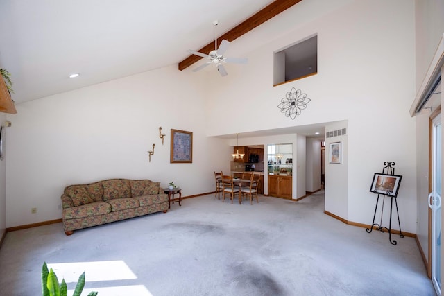 3108 N Rivers Edge Dr, Wayne, MI 48184 - living area with baseboards, beamed ceiling, high vaulted ceiling, and light colored carpet