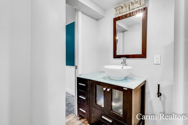 bathroom featuring vanity and wood finished floors