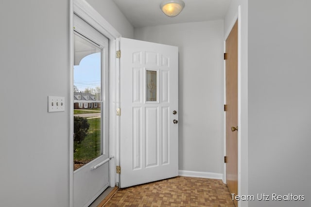foyer entrance with a wealth of natural light