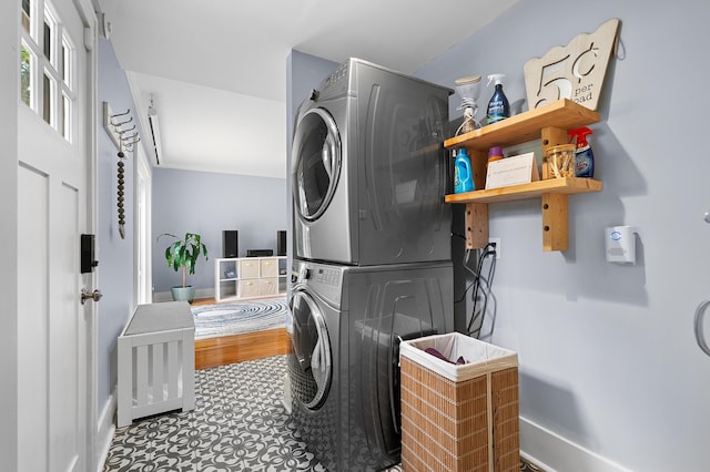 1021 Roseland Ave, Kalamazoo, MI 49001 - washroom with estacked washer and dryer and baseboards