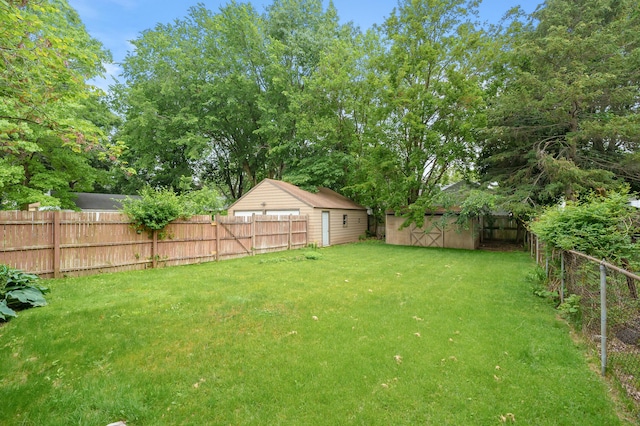 1021 Roseland Ave, Kalamazoo, MI 49001 - fenced backyard with a storage unit
