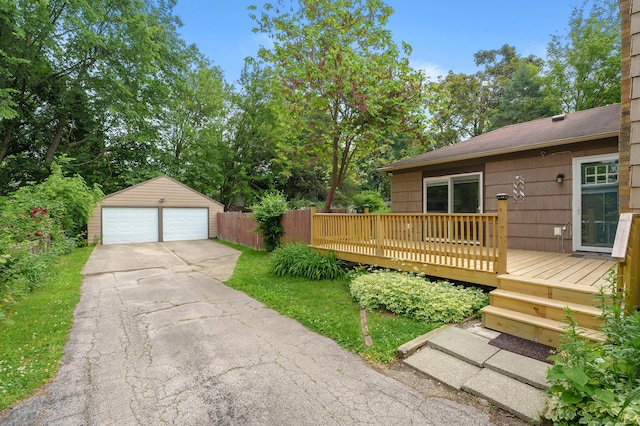 1021 Roseland Ave, Kalamazoo, MI 49001 - view of yard with a detached garage, an outbuilding, and a deck
