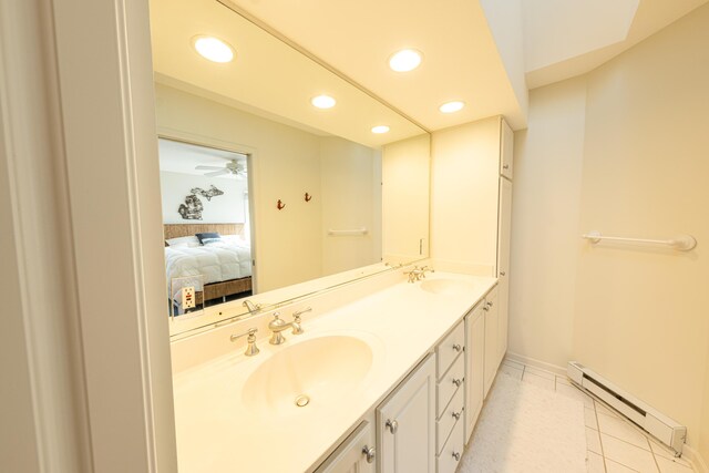 14 N Lighthouse Dr, Mears, MI 49436 - ensuite bathroom with recessed lighting, a sink, baseboards, and a baseboard heating unit