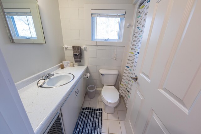 14 N Lighthouse Dr, Mears, MI 49436 - bathroom with toilet, tile patterned flooring, and vanity