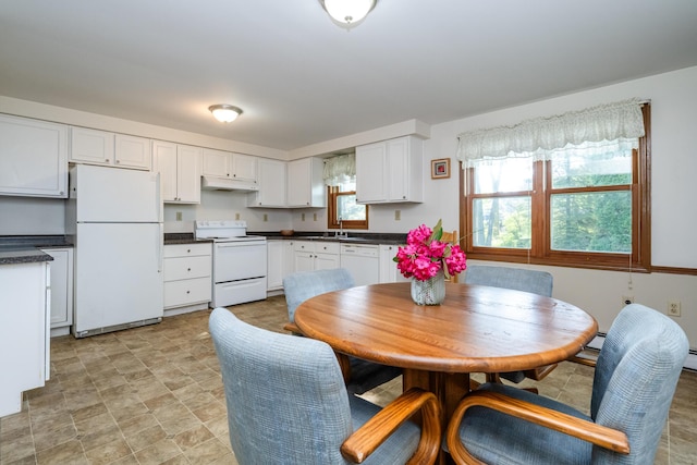 3715 Glen Haven Rd, Saint Joseph, MI 49085 - dining area with stone finish flooring and a baseboard radiator