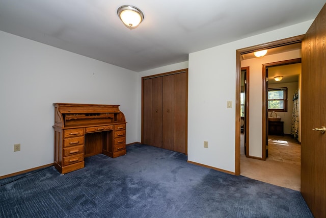 3715 Glen Haven Rd, Saint Joseph, MI 49085 - unfurnished bedroom featuring dark carpet, a closet, and baseboards