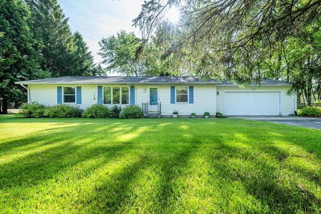 3715 Glen Haven Rd, Saint Joseph, MI 49085 - single story home featuring a garage, asphalt driveway, and a front lawn