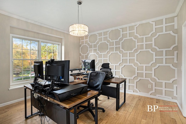 home office featuring light wood-style floors, baseboards, crown molding, and an inviting chandelier