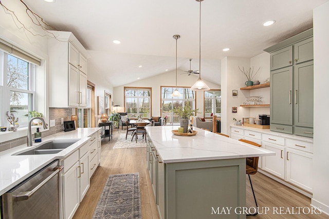 13460 Cottage View Ct, Gowen, MI 49326 - kitchen with a sink, stainless steel dishwasher, recessed lighting, light wood finished floors, and a kitchen island