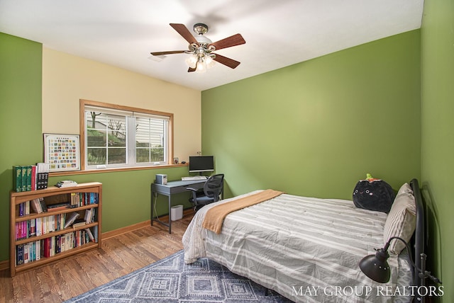 13460 Cottage View Ct, Gowen, MI 49326 - bedroom featuring baseboards, wood finished floors, and a ceiling fan