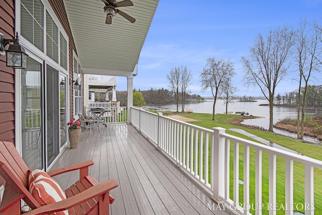 13460 Cottage View Ct, Gowen, MI 49326 - wooden terrace featuring a water view, a yard, and a ceiling fan