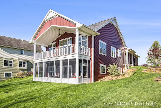 13460 Cottage View Ct, Gowen, MI 49326 - rear view of property featuring a balcony, a sunroom, and a yard