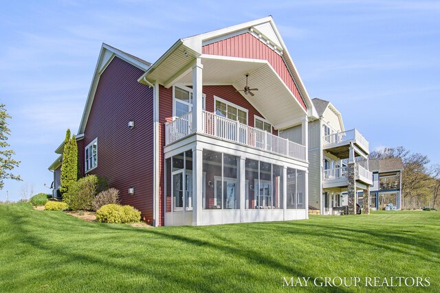13460 Cottage View Ct, Gowen, MI 49326 - back of property featuring a balcony, a ceiling fan, a yard, and a sunroom