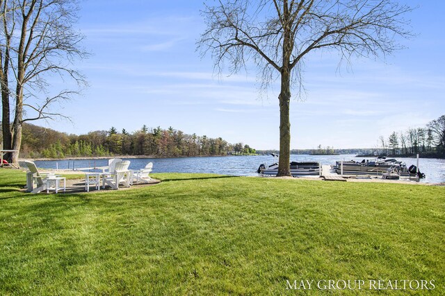 13460 Cottage View Ct, Gowen, MI 49326 - dock area with a water view and a lawn