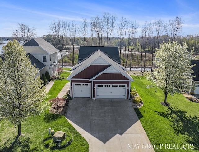 13460 Cottage View Ct, Gowen, MI 49326 - view of front of home with concrete driveway, a front yard, board and batten siding, and a garage