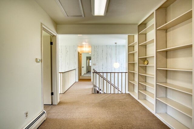20425 Thornapple Ln, Big Rapids, MI 49307 - hall with attic access, a baseboard heating unit, carpet, and an upstairs landing