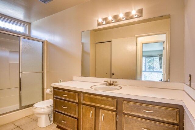 20425 Thornapple Ln, Big Rapids, MI 49307 - bathroom with vanity, tile patterned floors, a shower stall, and toilet
