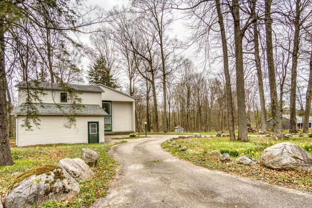 20425 Thornapple Ln, Big Rapids, MI 49307 - view of street featuring aphalt driveway