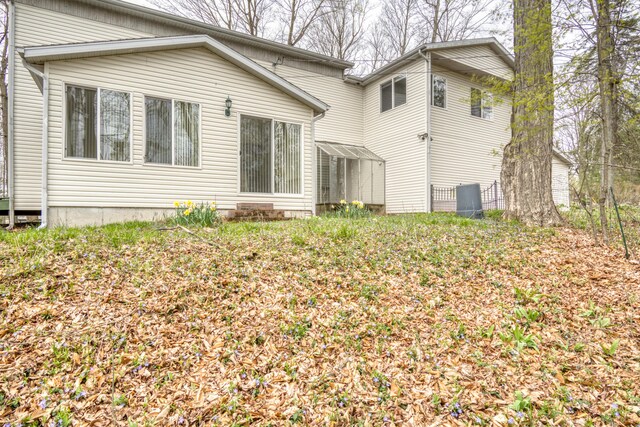 20425 Thornapple Ln, Big Rapids, MI 49307 - rear view of house with central AC unit