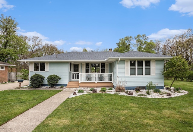 409 Louise Ave, Dowagiac, MI 49047 - ranch-style home with a porch, a shingled roof, a front lawn, and a chimney