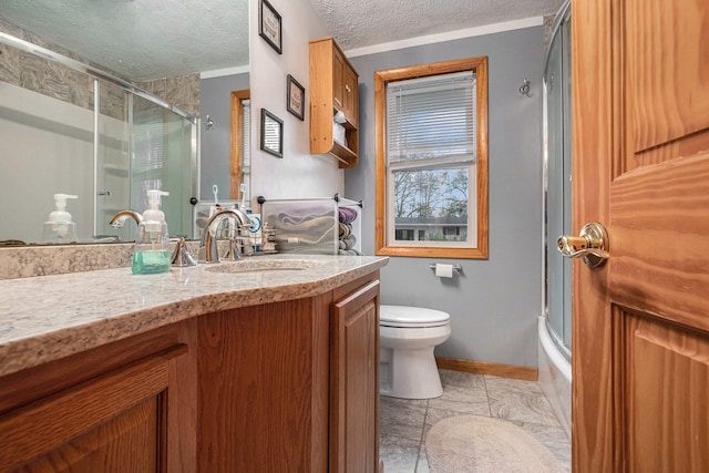 409 Louise Ave, Dowagiac, MI 49047 - full bathroom with vanity, baseboards, toilet, and a textured ceiling