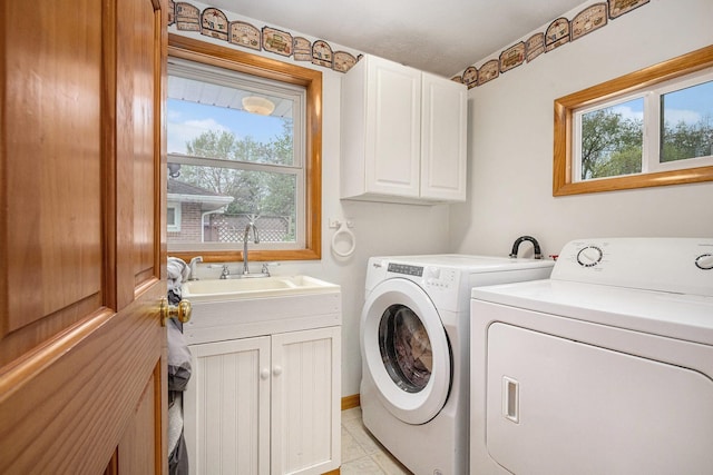 409 Louise Ave, Dowagiac, MI 49047 - laundry room with separate washer and dryer, a sink, cabinet space, and light tile patterned flooring