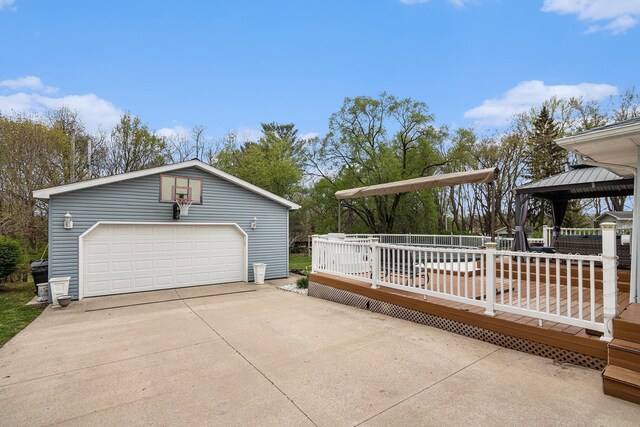 409 Louise Ave, Dowagiac, MI 49047 - view of home's exterior featuring a gazebo, a garage, a wooden deck, and an outbuilding