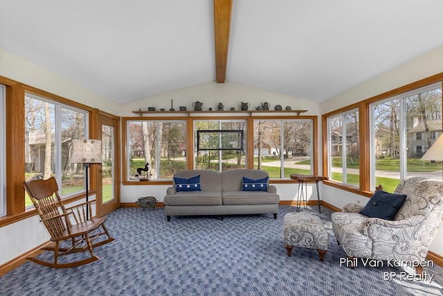 sunroom featuring carpet flooring, vaulted ceiling with beams, baseboards, and a wealth of natural light