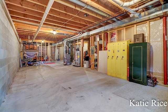unfinished below grade area with heating unit and gas water heater