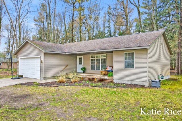 single story home featuring an attached garage, a shingled roof, driveway, and covered porch