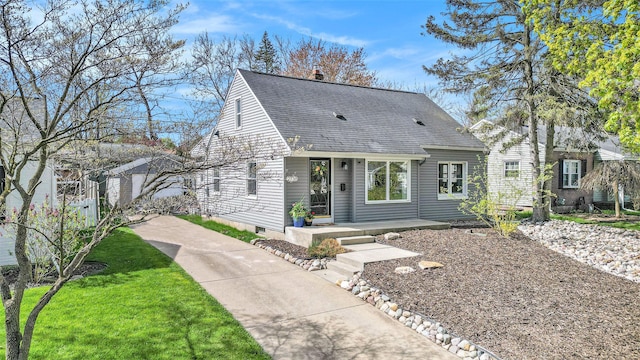 view of front of house featuring a shingled roof and a chimney