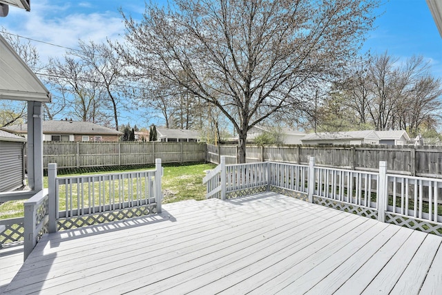 deck with a fenced backyard